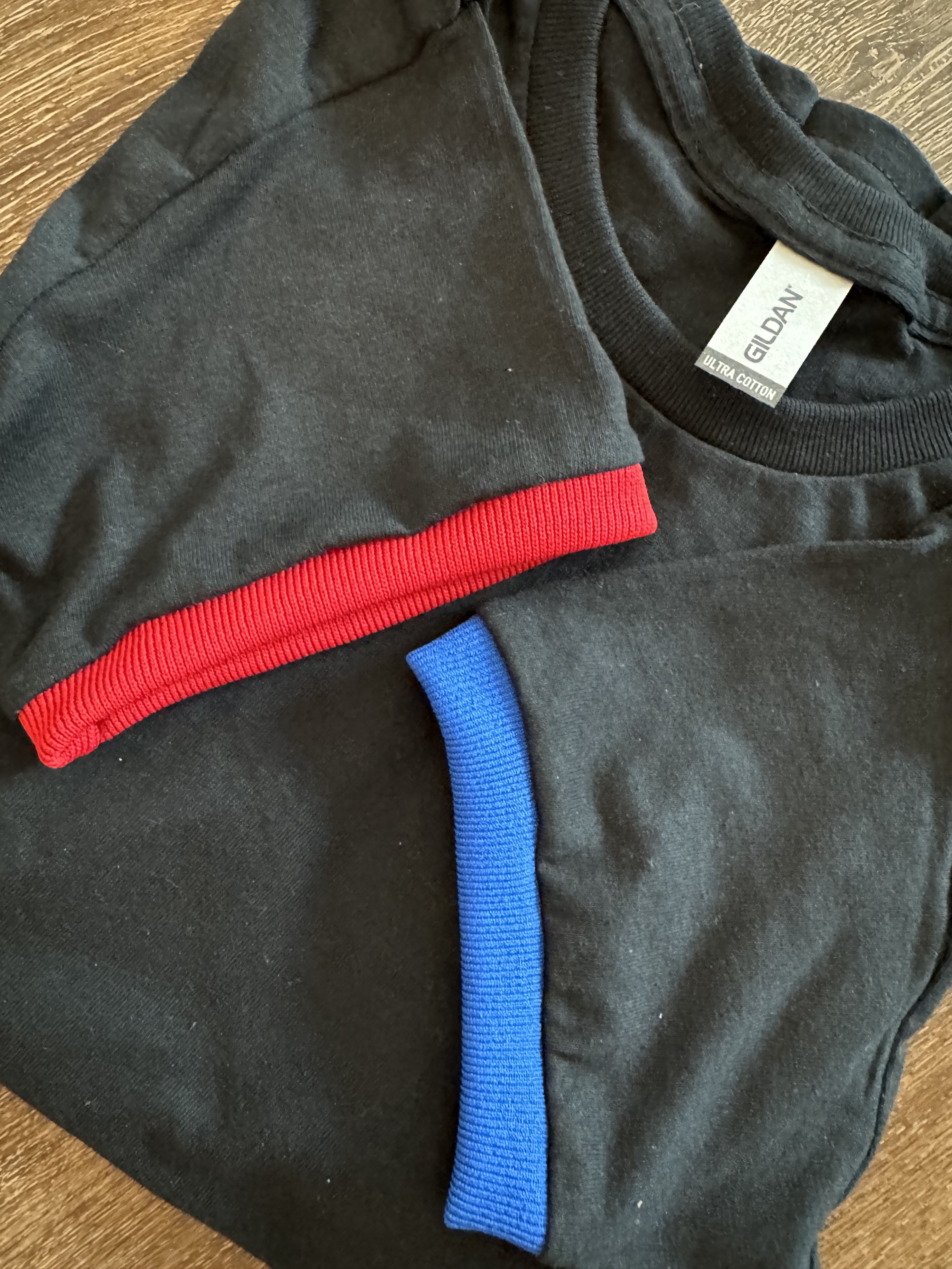 Sample image of Men's Black Cotton T-Shirt w/ Red & Blue Cuffs